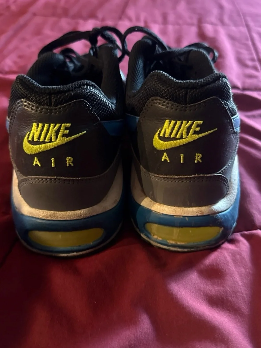 Nike Kids Black Sneakers with Blue Swoosh